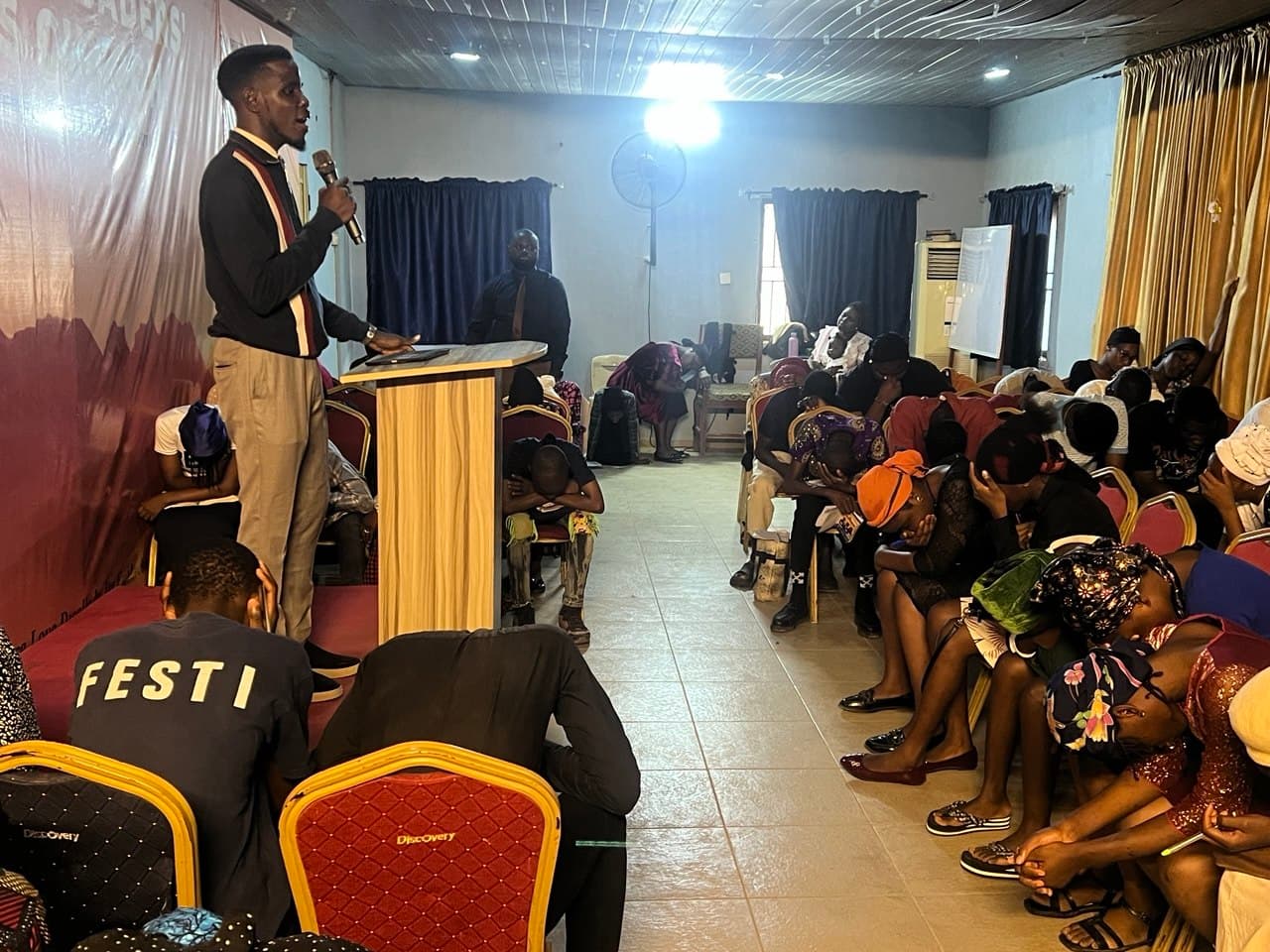 Timothy Adewole with teenagers